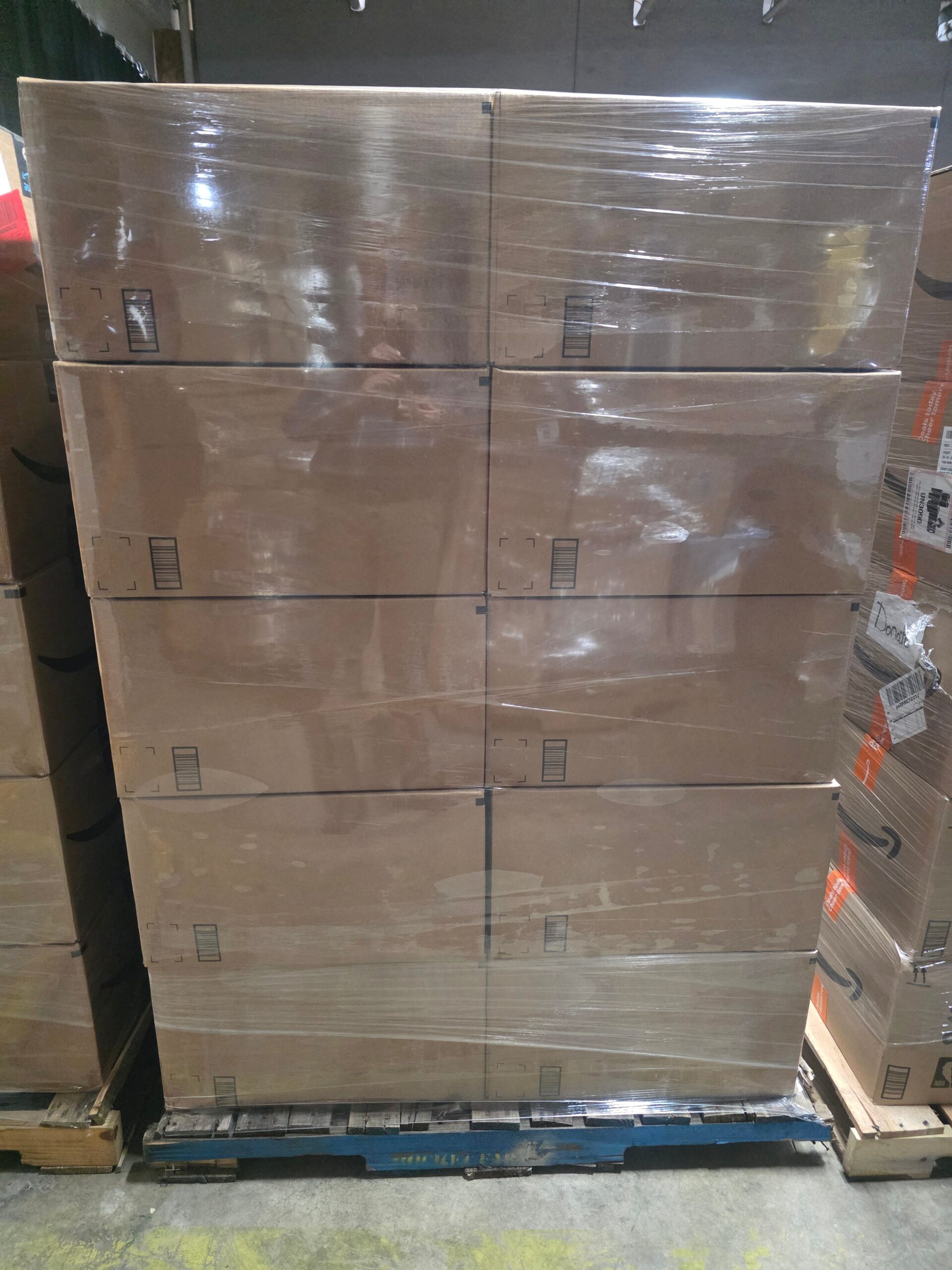 1779316579577_5866b3 Amazon general merchandise mystery box pallet stacked and shrink-wrapped for resale