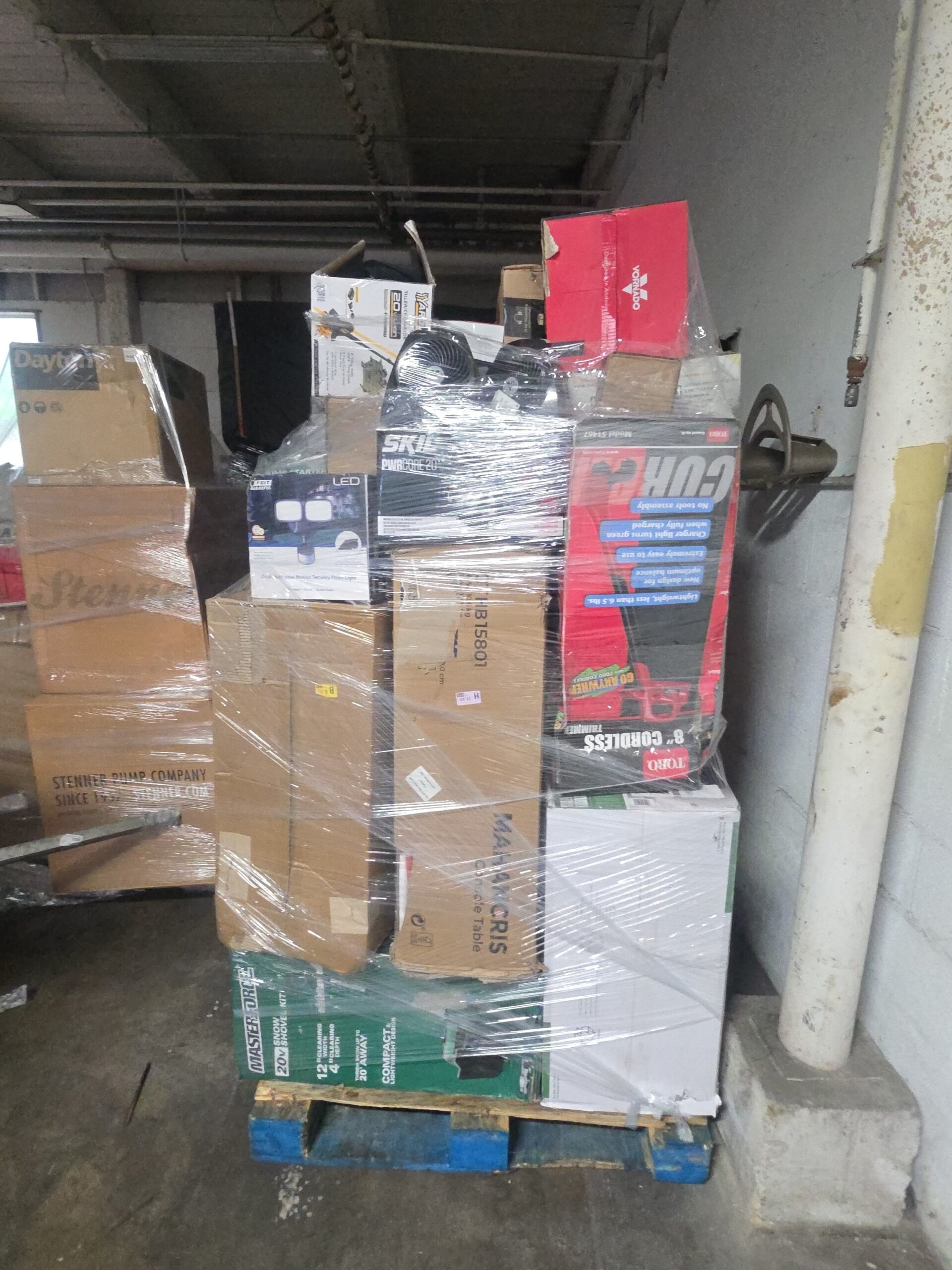 1779383333918_yrprz Mixed retailer pallet with tools stacked with housewares, hand tools and general merchandise ready for resale