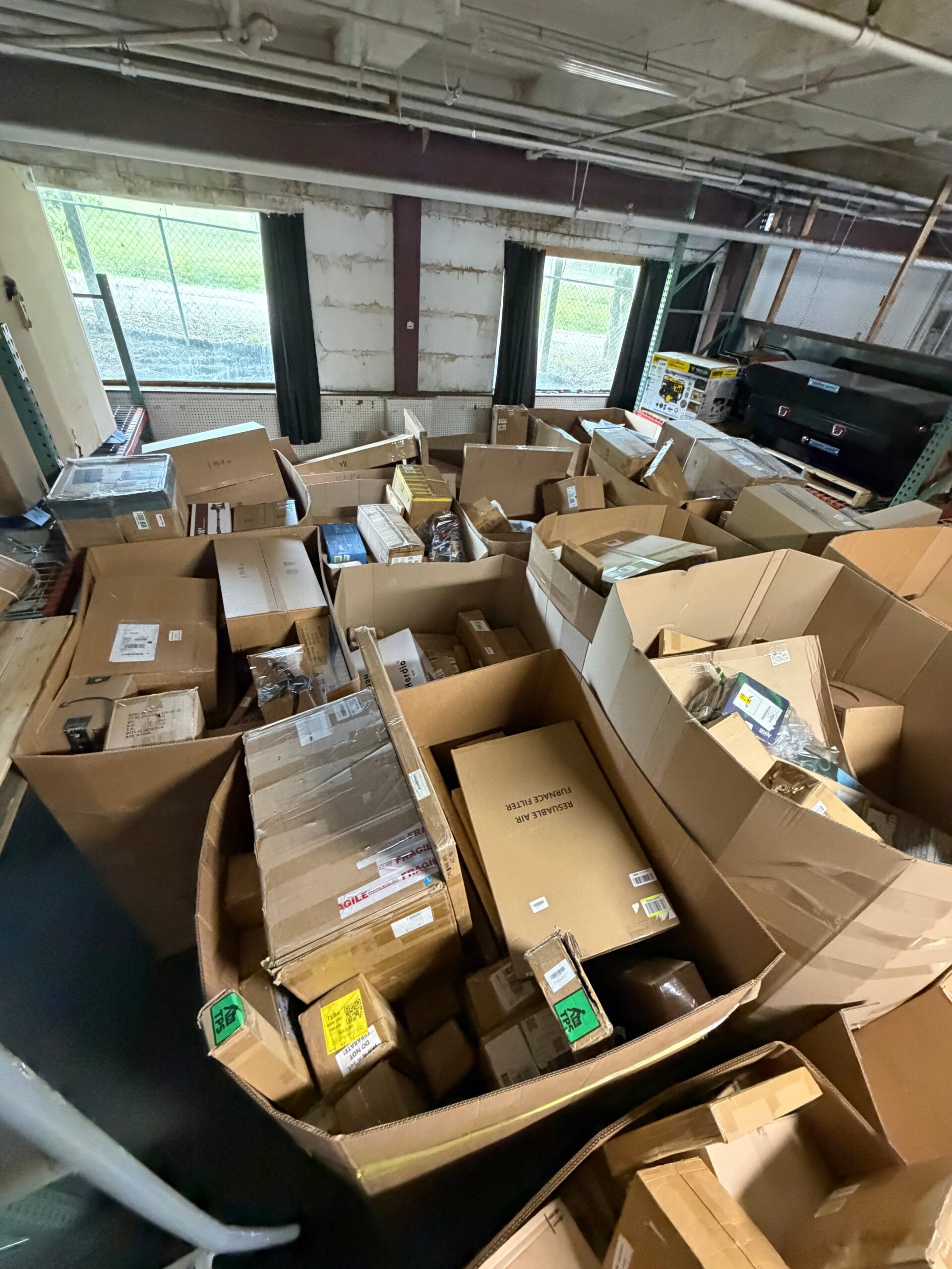 1783443796486_ewotaf Raw Amazon general merchandise pallet stacked 5ft tall with medium boxes of mixed returns