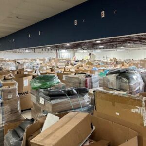 Wholesale liquidation pallets in warehouse — Vault Bridge Liquidators