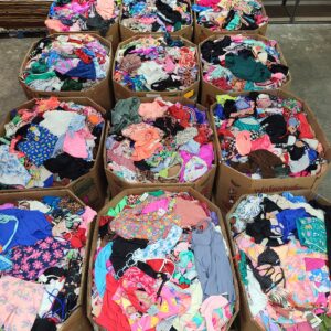 Target swimsuits pallet with 800-1000 assorted women's, men's and kids' bathing suits stacked for wholesale resale