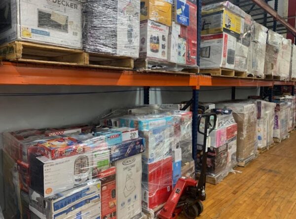 354f76aa-831e-4cf9-a681-9aa5723bc397.JPG Wholesale liquidation pallets in warehouse — Vault Bridge Liquidators
