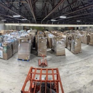 Wholesale liquidation pallets in warehouse — Vault Bridge Liquidators