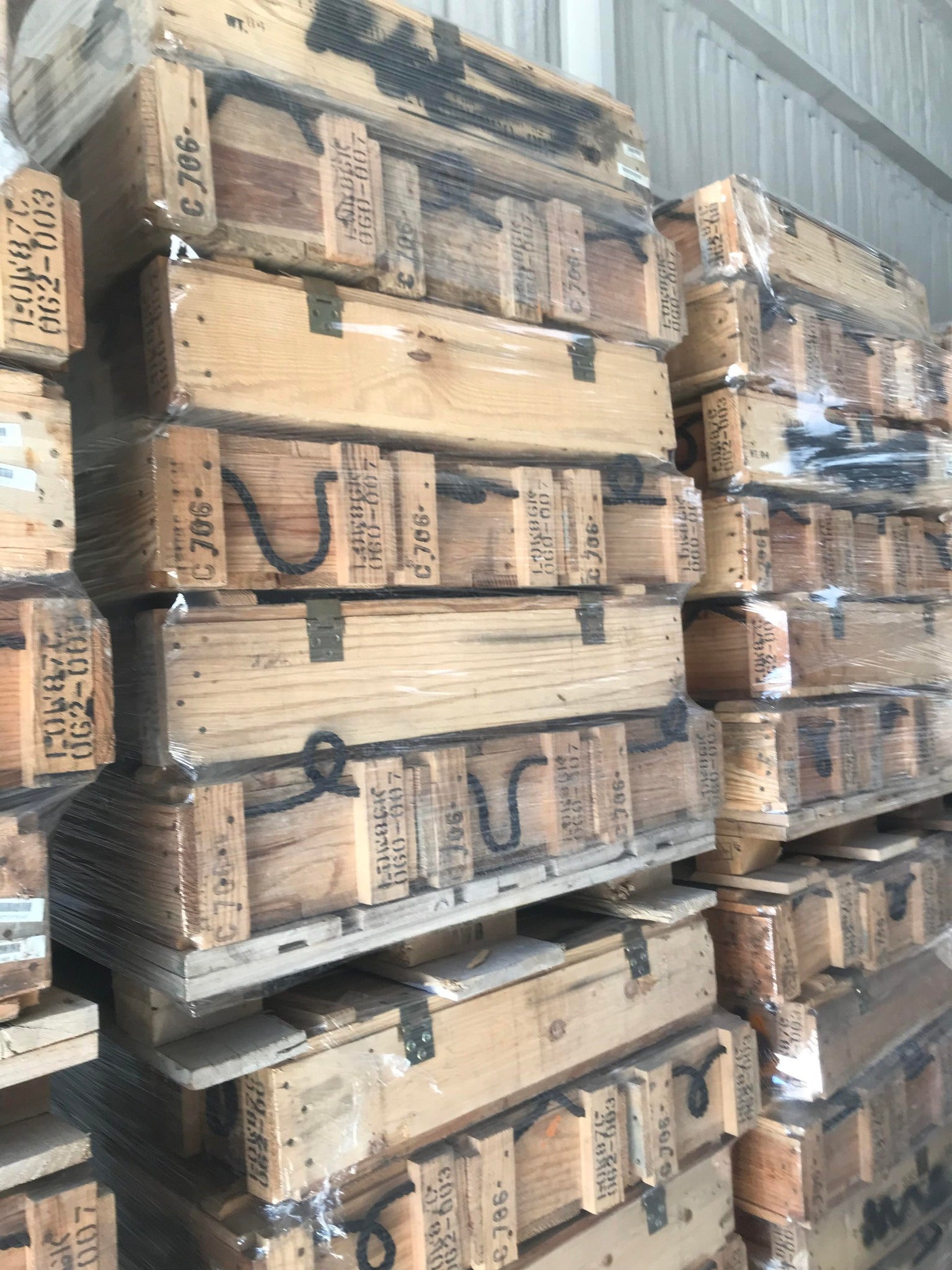Ammo-Crate-Truckload Wooden ammo crate truckload of stacked surplus wood ammunition crates on pallets ready for resale