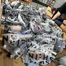 Shein liquidation pallet stacked with trendy assorted apparel for resale