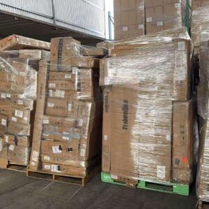 Tribesigns furniture truckload of desks and bookcases stacked on pallets for resale