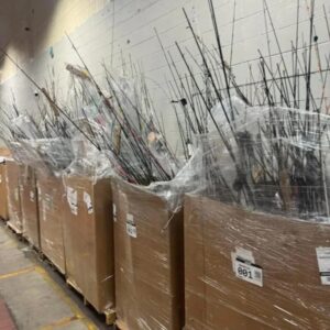 Fishing tackle liquidation pallet stacked with rods, reels and accessories for resale