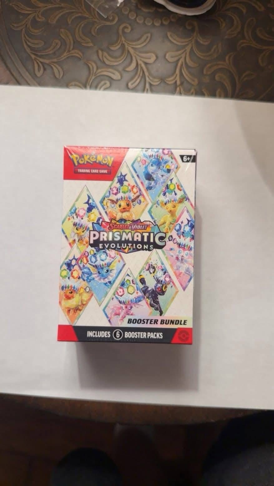 img_3306 Pokemon Cards Pallet 25 — Wholesale Pokemon cards pallet with 25 units of sealed booster boxes and loose TCG cards