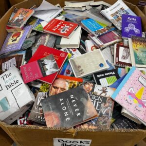 300-piece wholesale books pallet of assorted resale books stacked for liquidation
