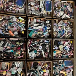High end makeup liquidation pallet stacked with 200+ assorted prestige cosmetics and beauty shelf pulls