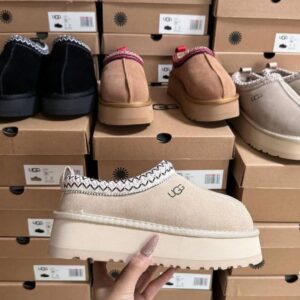 UGG boots liquidation pallet stacked with 60 to 120 pairs of Classic Mini and Tasman footwear ready for resale
