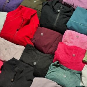 150-unit Lululemon clothes pallet of authentic activewear stacked and ready for resale