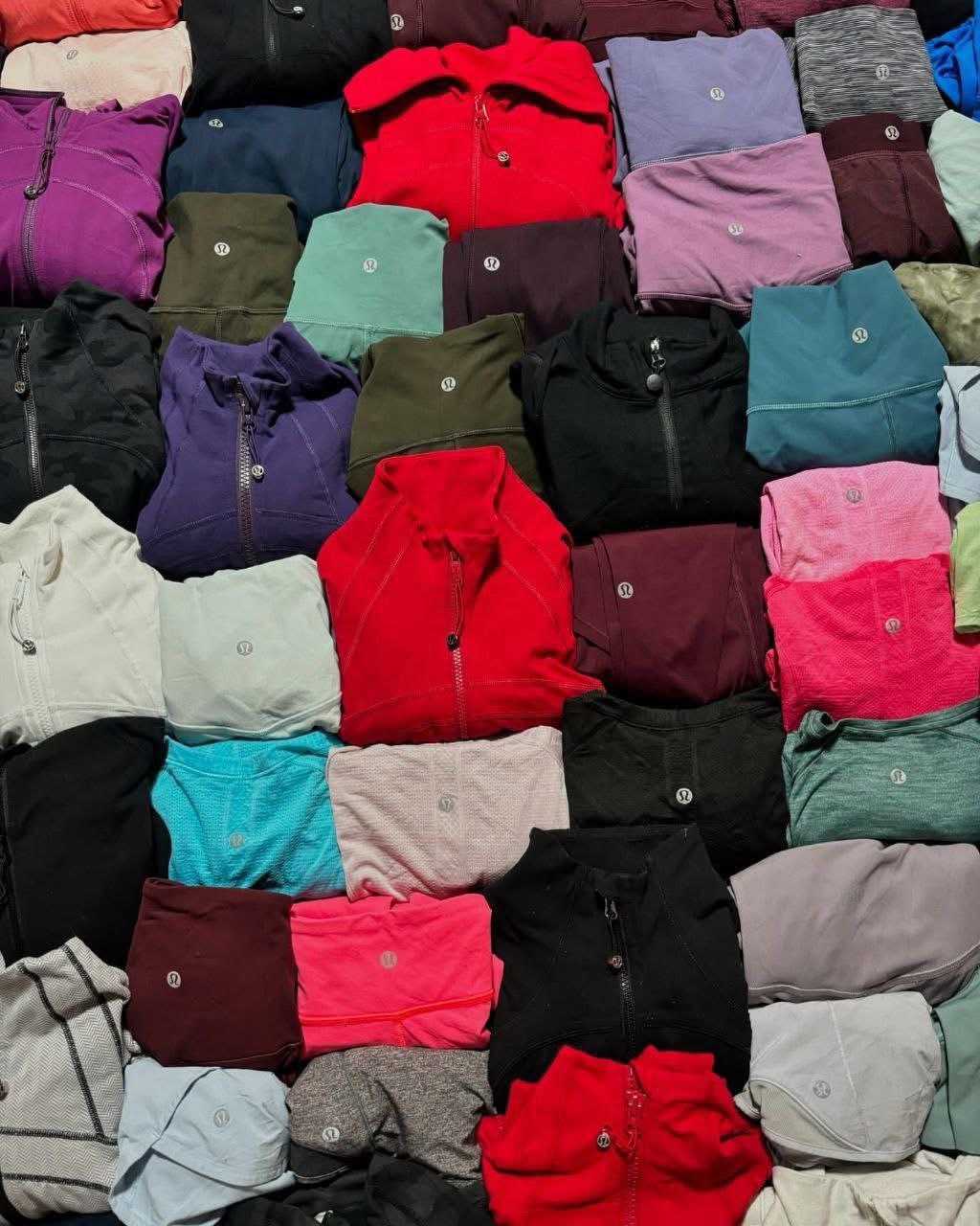 photo_6190586962641620963_y-1 200-unit Lululemon clothes pallet of authentic new-with-tags leggings and tops on a wholesale liquidation skid