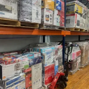 Wholesale liquidation pallets in warehouse — Vault Bridge Liquidators