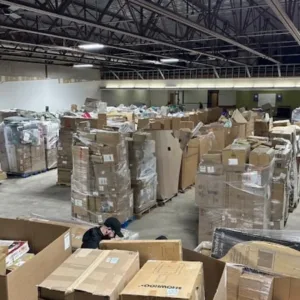 Wholesale liquidation pallets in warehouse — Vault Bridge Liquidators