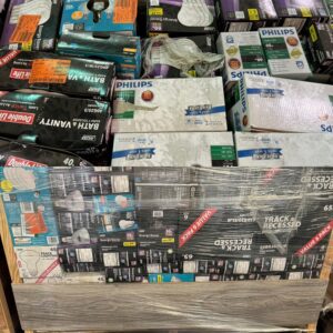 Home Depot lightbulb liquidation pallet stacked with LED and specialty bulb multi-packs