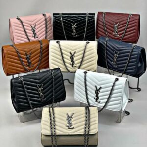 Women's handbag liquidation pallet stacked with assorted overstock purses and wallets
