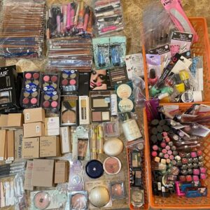 Wholesale cosmetics liquidation pallet stacked with mixed-brand makeup and beauty overstock ready for resale