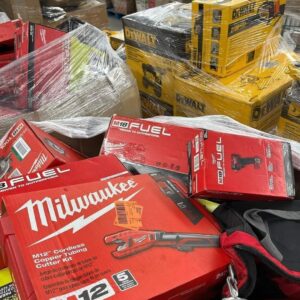 Tool liquidation pallet stacked with assorted power and hand tools ready for resale