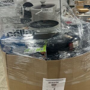 Macy's housewares liquidation pallet stacked with pots, linens, and home goods ready for resale