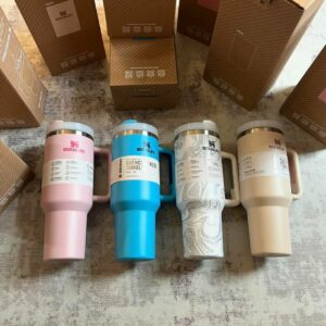 Stanley Starbucks cups pallet stacked with assorted insulated Quencher tumblers for resale
