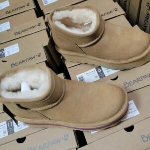 UGG shoes liquidation pallet stacked with overstock boots and slippers for resale